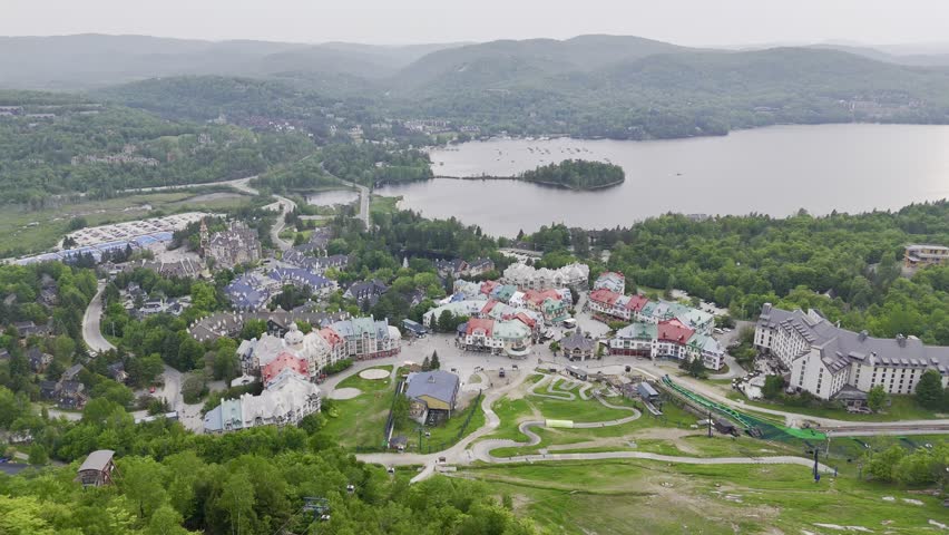 Aerial view of Mont Tremblant resort village, Quebec, Canada with lake, forest and mountain landscape in summer. g.