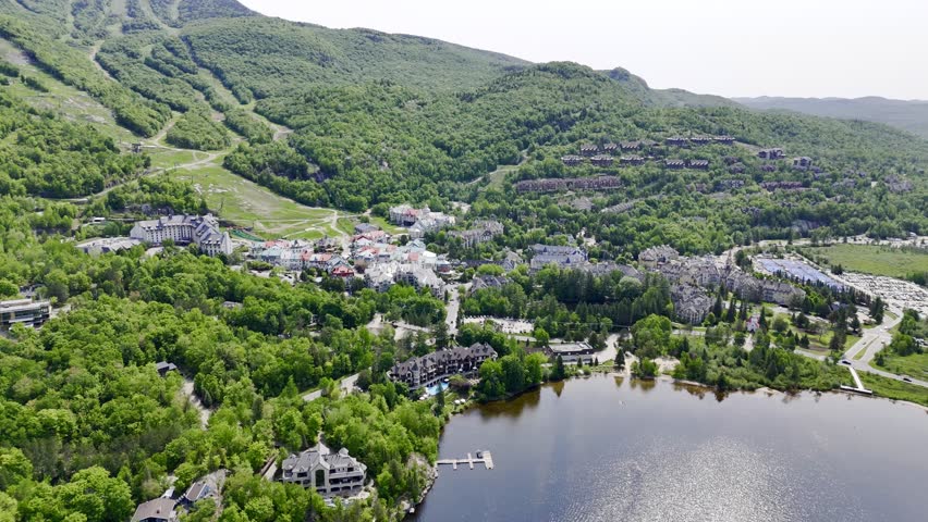 Aerial view of Mont Tremblant resort village, Quebec, Canada with lake, forest and mountain landscape in summer. g.