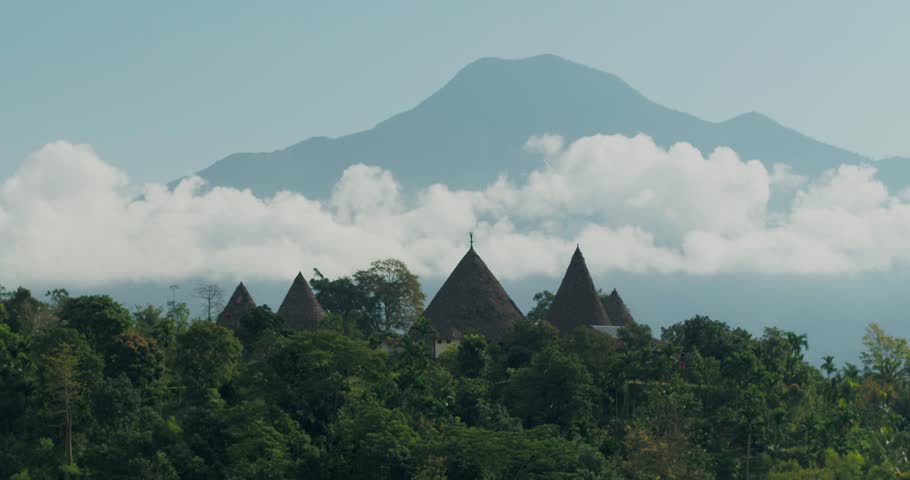 Wide Aerial Shot of Tropical Mountain Landscape with Soft Clouds Indonesia
