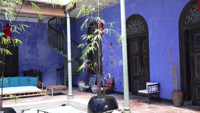 Elegant Blue Mansion courtyard in Penang, Malaysia with serene vibe