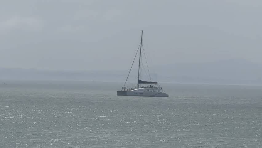 A yacht sailing in Table Bay, near Mouille Point, Cape Town.