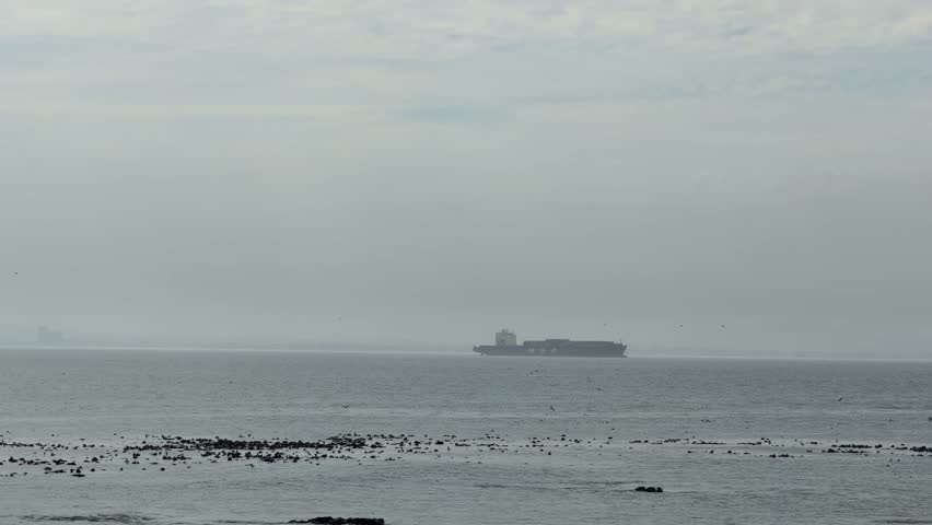 Big boat in the distance on the sea near Cape Town, South Africa.