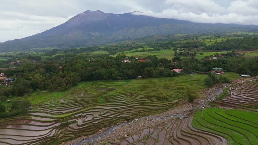 Aerial look at the lush tropical valley and hills at the base of Mount Canlaon in Canlaon City, Negros Oriental, Philippines. Fertile volcanic land and remote terrain