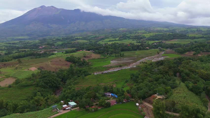 Aerial look at the lush tropical valley and hills at the base of Mount Canlaon in Canlaon City, Negros Oriental, Philippines. Fertile volcanic land and remote terrain