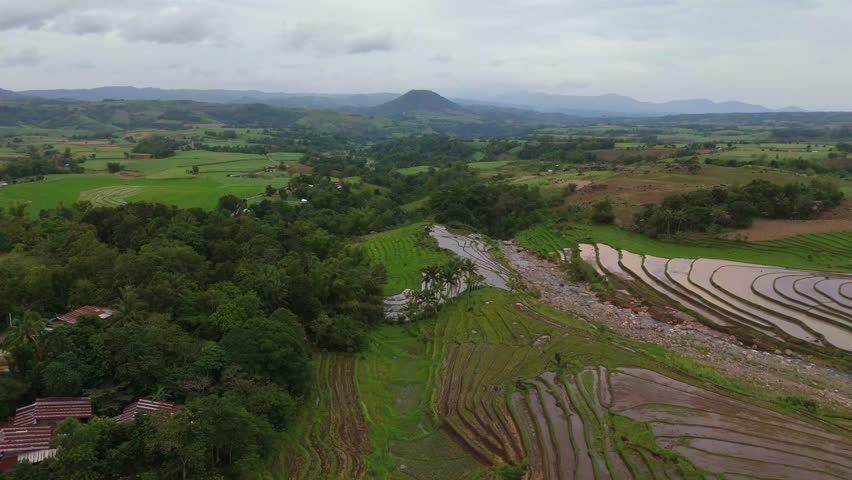 Aerial look at the lush tropical valley and hills at the base of Mount Canlaon in Canlaon City, Negros Oriental, Philippines. Fertile volcanic land and remote terrain