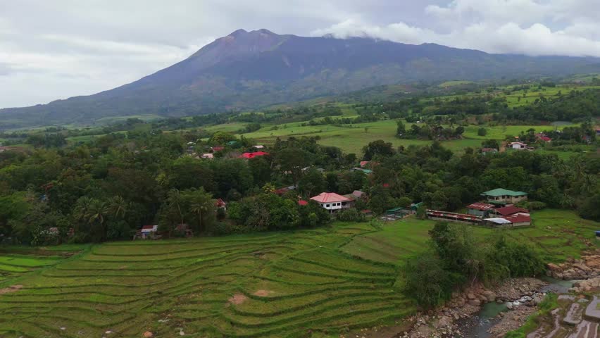 Aerial look at the lush tropical valley and hills at the base of Mount Canlaon in Canlaon City, Negros Oriental, Philippines. Fertile volcanic land and remote terrain