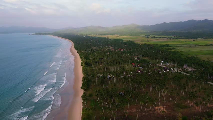 aerial drone shot of the endless white sand and turquoise waters of Long Beach in San Vicente, Palawan