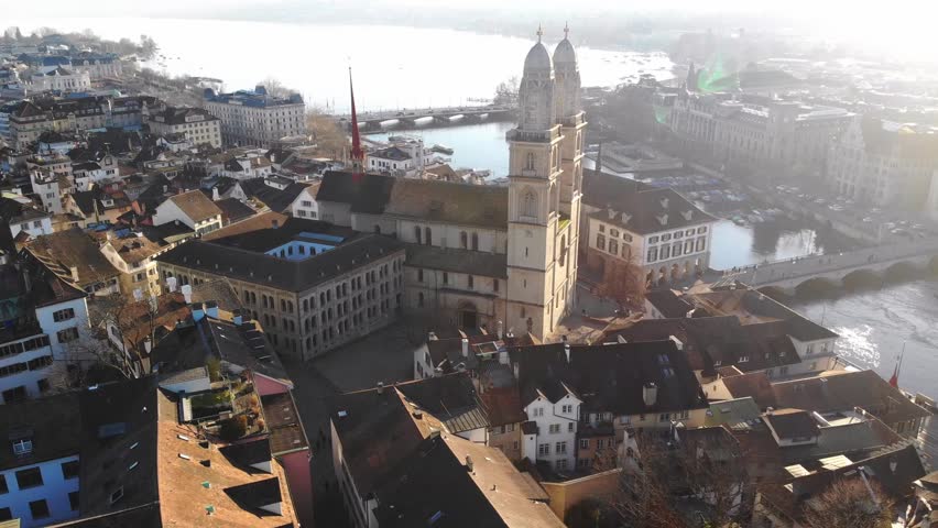 Grossmünster historic church with twin towers Zurich, Switzerland aerial drone Swiss city