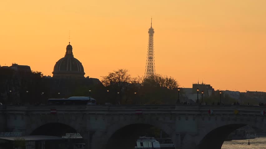 Sunset Over Seine River and Historic Bridge in Paris, France