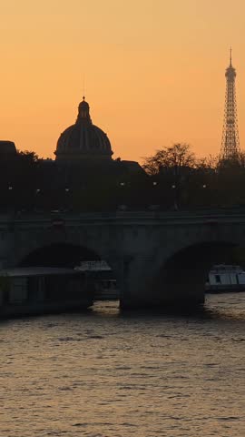 Sunset Over Seine River and Historic Bridge in Paris, France