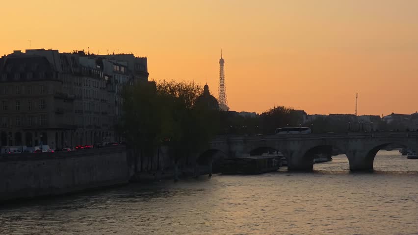 Sunset Over Seine River and Historic Bridge in Paris, France