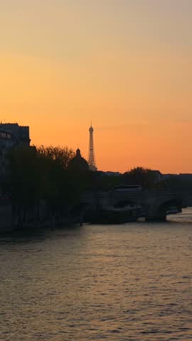 Sunset Over Seine River and Historic Bridge in Paris, France