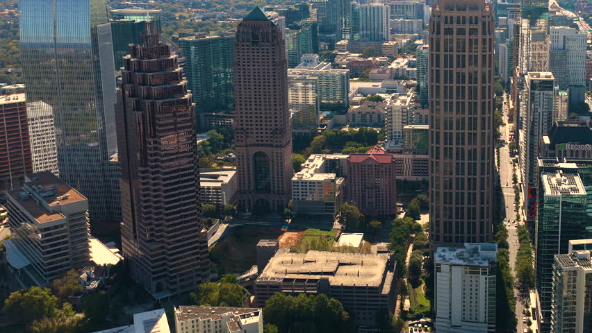 Atlanta city landscape with financial downtown skyscraper buildings architecture. Fast urban rhythm, daily commute and metropolitan lifestyle concept.