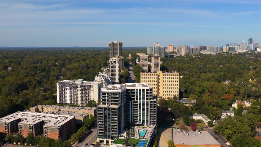 Atlanta, Georgia skyline with Buckhead uptown prominent buildings and roads stretching across the city. Modern urban infrastructure.