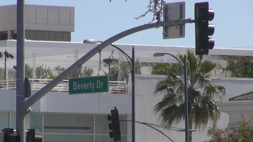 LOS ANGELES - USA, APRIL 2, 2013, Beverly drive sign, Santa Monica Boulevard with traffic light by day