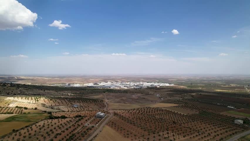 Kilis Organized Industrial Zone located within olive groves and agricultural land, illustrating the connection between industrial development and rural landscape in southeastern Türkiye.