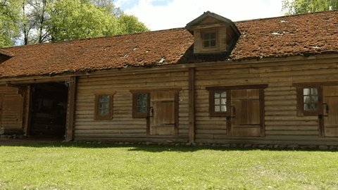 Sideways Drone Shot along Wooden Building Exterior