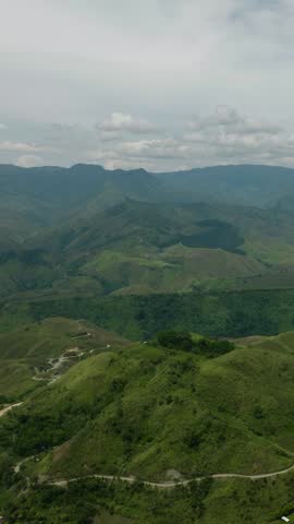 Tropical mountain valley with green forest and trees. Mindanao, Philippines. Vertical view.