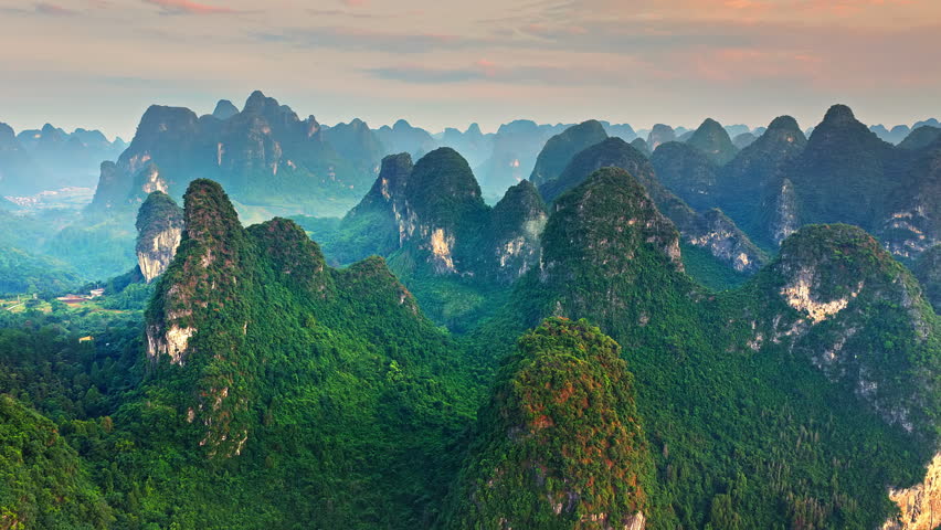 Aerial view of majestic karst mountain peaks at sunrise in Guilin, Guangxi, China. Scenic nature background.