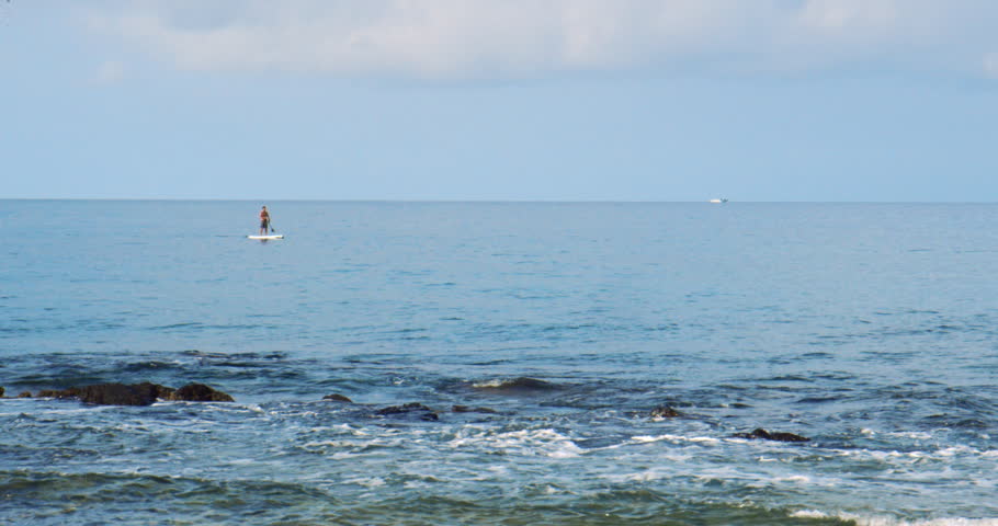 Paddleboarder Paddling In Ocean, Waimeia, Hawaii