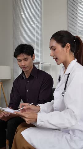 Professional female doctor in a white coat consulting and explaining medical results to a male patient