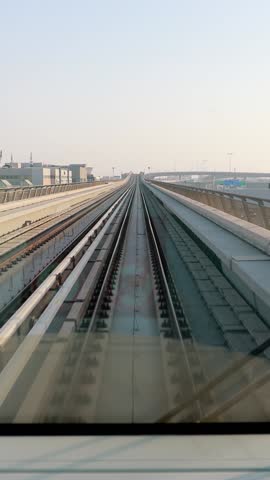 Dubai, UAE, United Arab Emirates. Monorail POV Subway train ride in Dubai. Traffic On Street In Dubai.