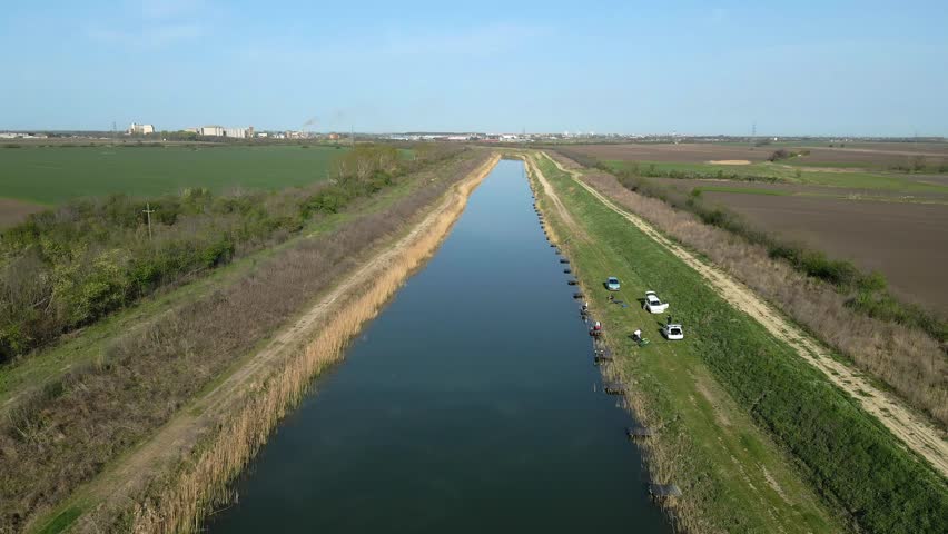 Exploring Veliki Backi Kanal in Serbia with nature and fishing activities along the serene waters