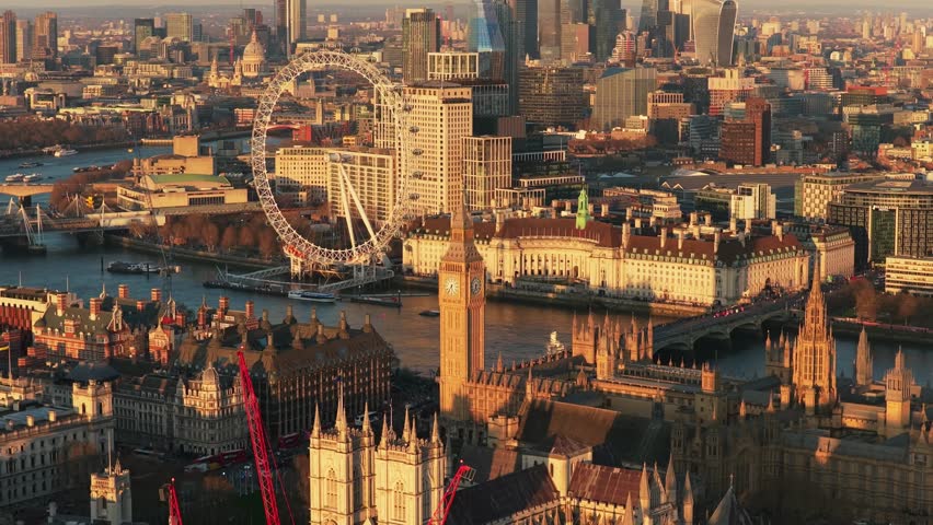 Golden hour light illuminating London cityscape with River Thames, Big Ben, Houses of Parliament, and London Eye, showcasing city's iconic architecture