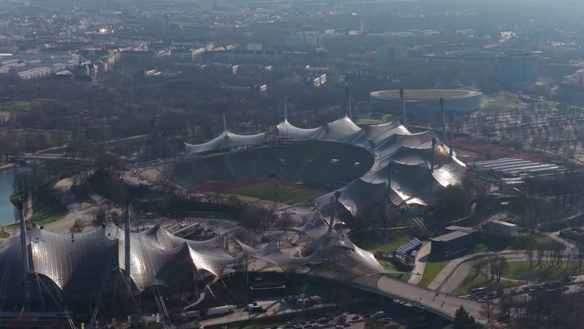 Aerial perspective of Olympiapark in Munich featuring iconic Olympiastadion architecture, Olympic Tower and cityscape of Bavaria's capital, Germany
