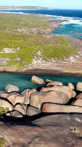 Vertical aerial drone view of Elephant Rocks Beach and Elephant Cove. William Bay National Park near Denmark. Stunning natural rock formations surrounded by turquoise waters.