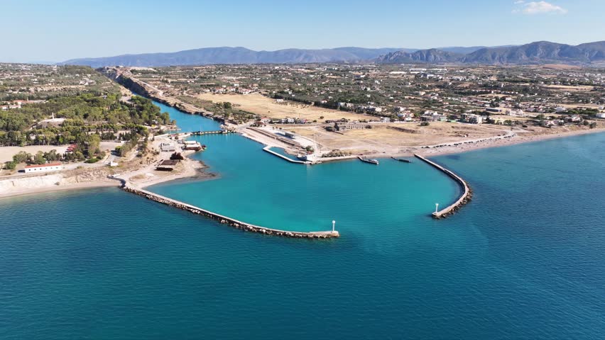 Aerial drone rotational video of Corinth Canal entrance of Isthmos or Isthmus, Peloponnese, Greece