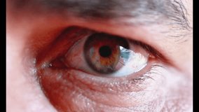 Extreme close up of a man's hazel eye blinking, showing detailed iris, pupil and eyelashes - Powered by Shutterstock - Get 15% off with code: PIKWIZARD15