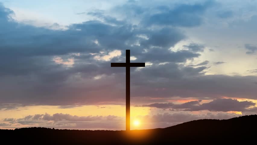 Christian cross on hill outdoors at sunrise. Resurrection of Jesus. Spiritual hope and resurrection concept, Good Friday, Easter. 