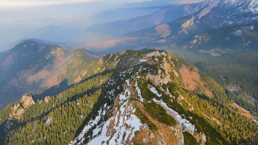 An aerial view of the snow-capped Rocky Mountains near Loveland Pass, Colorado, USA.