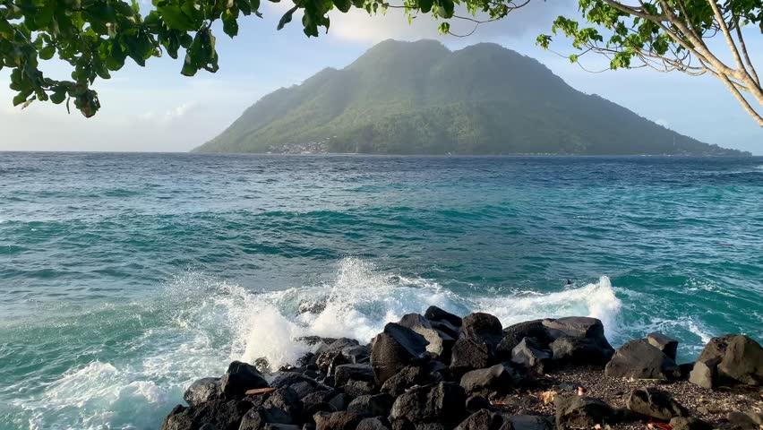 beautiful sea and mountain views, beautiful blue sea, vacation at the beach, mountain view from the beach, ocean waves, clean sea water.