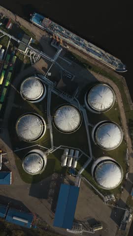 Modern crude oil storage terminal and its vital role in the global energy market. Vertical, vertical video