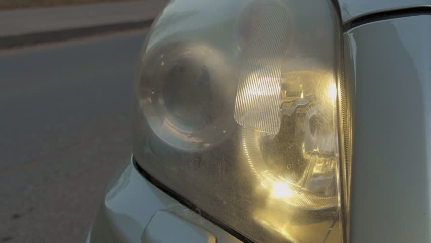 Headlamp restoration process. DIY repair of cloudy headlamp. Steps to fix foggy headlamp with scratches and oxidation