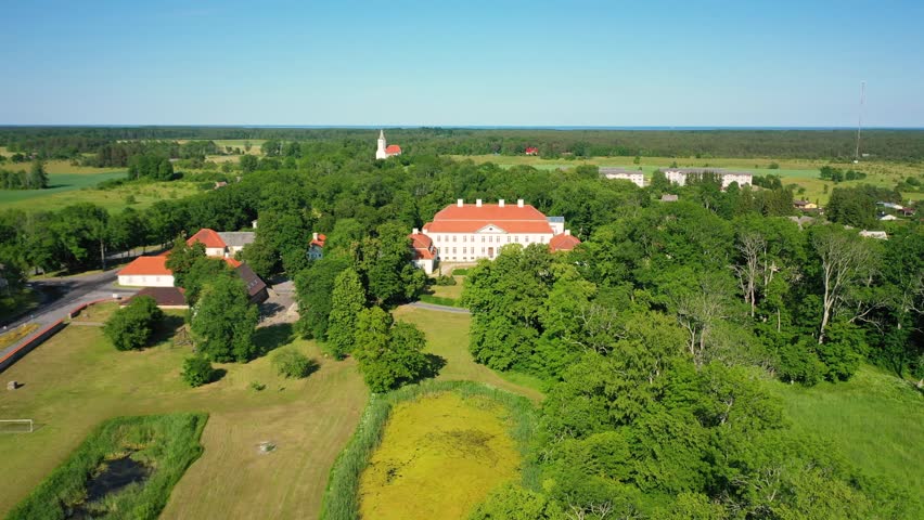 Aerial 4K video from a drone to Suuremoisa baroque manor ensemble in Estonia.  Hiiumaa, Estonia, baltic.