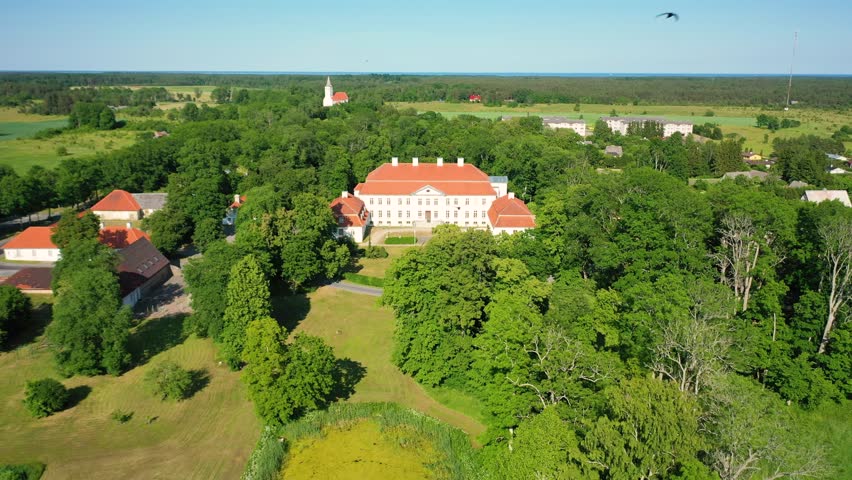 Aerial 4K video from a drone to Suuremoisa baroque manor ensemble in Estonia.  Hiiumaa, Estonia, baltic.