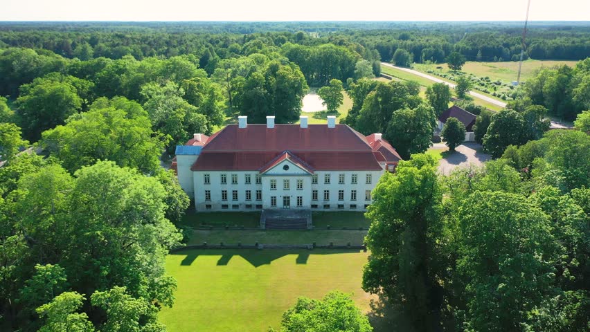 Aerial 4K video from a drone to Suuremoisa baroque manor ensemble in Estonia.  Hiiumaa, Estonia, baltic.
