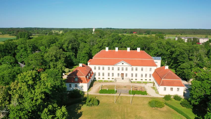 Aerial 4K video from a drone to Suuremoisa baroque manor ensemble in Estonia.  Hiiumaa, Estonia, baltic.