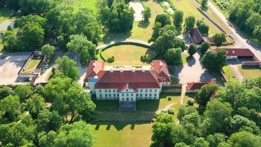 Aerial 4K video from a drone to Suuremoisa baroque manor ensemble in Estonia.  Hiiumaa, Estonia, baltic.