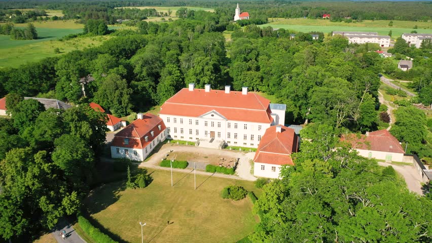 Aerial 4K video from a drone to Suuremoisa baroque manor ensemble in Estonia.  Hiiumaa, Estonia, baltic.