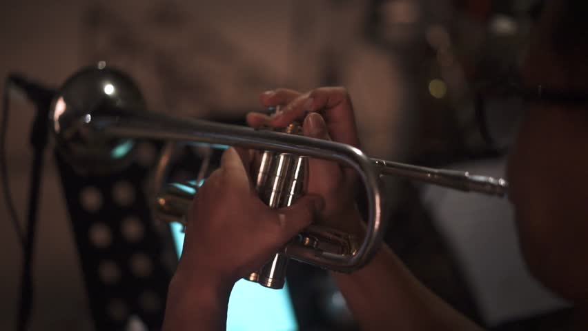 Professional Musician Playing Silver Trumpet in Live Jazz Performance