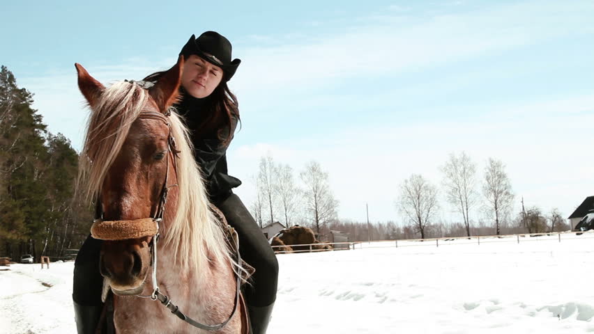 girl cowboy sitting on a horse