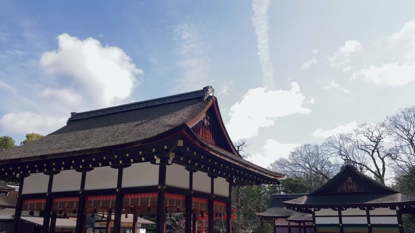Calm view of the Kamo Mioya Shrine in Kyoto, Japan, also known as the Shimogamo Shrine, which is a UNESCO World Heritage Site. This video contains forested shrines, traditional wooden structures, and detailed cuts of the shrine. It reflects the quiet and spiritual atmosphere of one of the oldest and most important Shinto shrines in Kyoto.