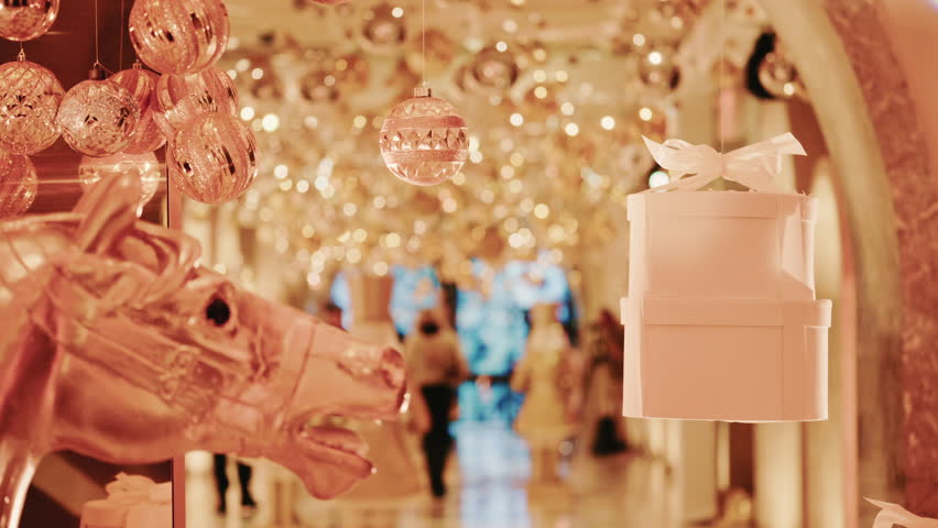 Elegant close-up of a decorative horse statue displayed inside a warmly lit hallway filled with golden holiday lights and ornaments