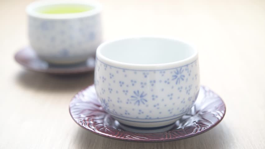 Loop video of hands pouring tea
