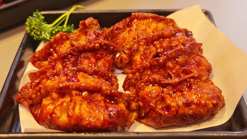 Spicy gyoza on a plate.