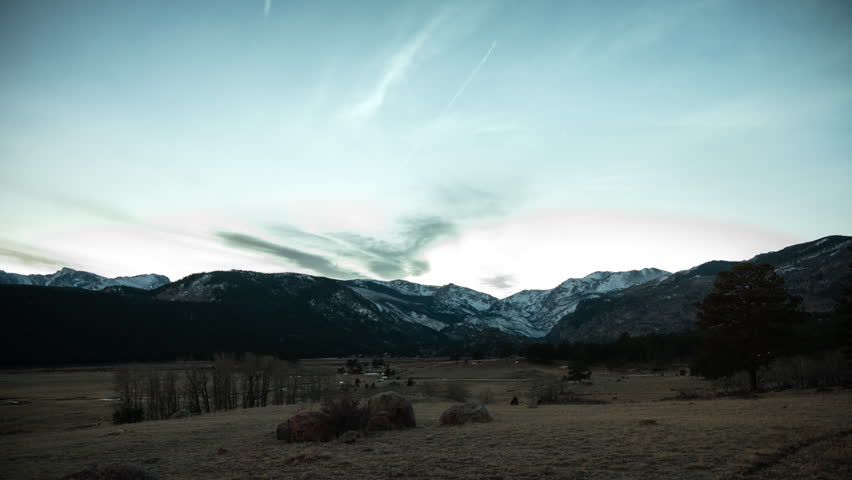 Day to night transition of sunset and the stars coming out over the Rocky Mountains in Rocky Mountain National Park, Time Lapse